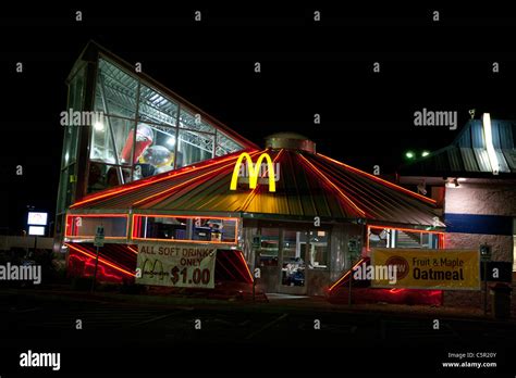 Exterior of McDonald's restaurant at night, shaped like a flying saucer ...