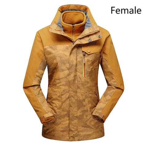 Two sets of waterproof and breathable mountaineering clothes for men and women in winter outdoor ...