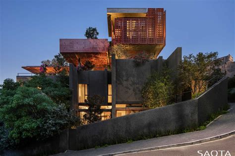 Red-Pigmented Concrete Screens Surround This New Home In Cape Town