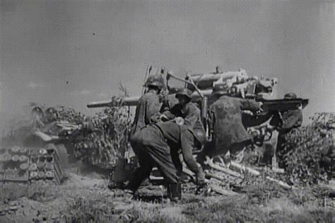 88mm Flak gun firing on the Eastern Front and a probably unrelated T-34 ...