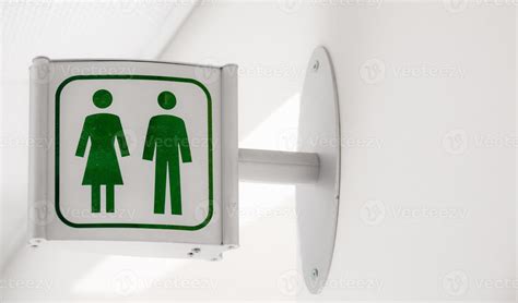 Public modern white and green restroom sign on white wall 3679653 Stock ...