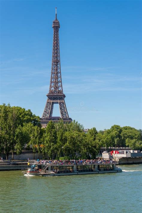 Bateau Mouche on the Seine River with Eiffel Tower in the Background Editorial Image - Image of ...
