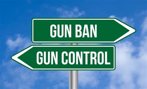 Premium Photo | Gun ban or gun control road sign on blue sky background