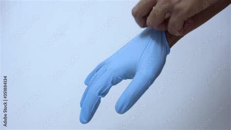 Wearing gloves due to the COVID - 19 pandemic. Using protective ...