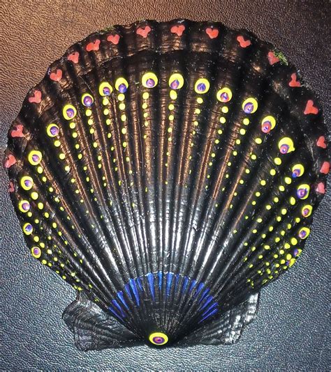 the fan is decorated with hearts on it