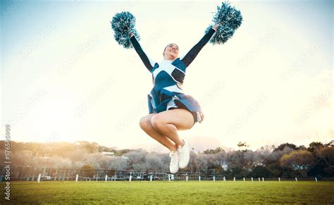 Sports woman, sky and cheerleader jump with energy to celebrate goal outdoor. Cheerleading or ...