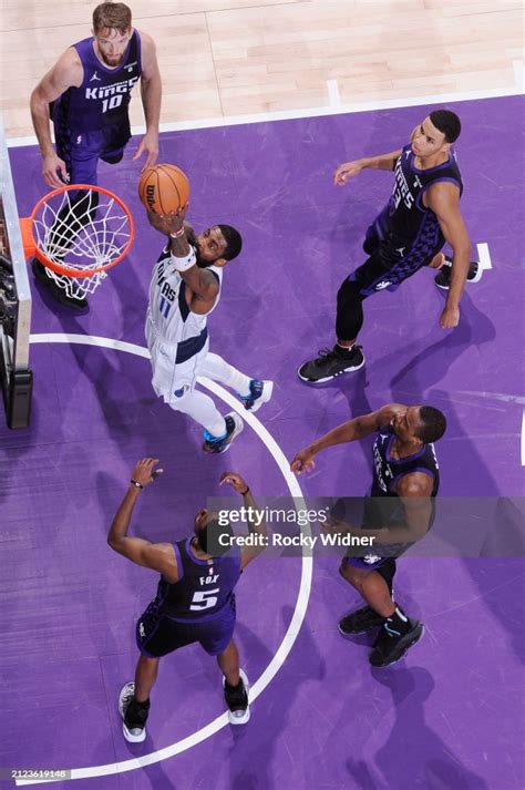 Kyrie Irving of the Dallas Mavericks goes up for the dunk during the ...