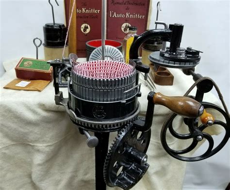 an antique sewing machine is on display with other old fashioned machines and books in the ...