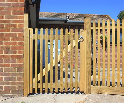 Mitre Topped Wooden Palisade Gates | Jacksons Fencing