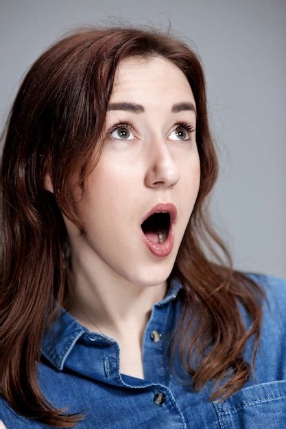 Free Photo | Portrait of young woman with shocked facial expression