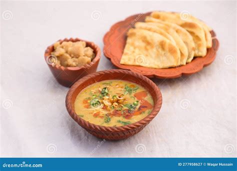 Desi Breakfast, Haleem, Halim, Dhaleem, Halwa and Paratha Served in Dish Isolated on Background ...