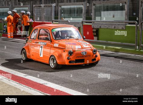 Italian Bicilindriche Cup, Orange Fiat 500 racing car moving from pit lane to formation lap ...