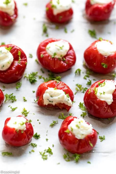 tomatoes with cream cheese and parsley on top