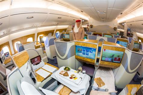 I splurged my miles to fly Emirates' luxe business class. I ate a multi ...