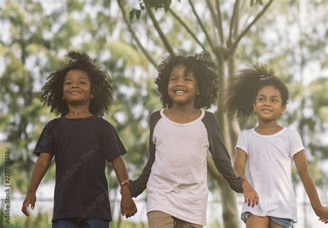 Kids playing with friends. Children African american holding hands ...