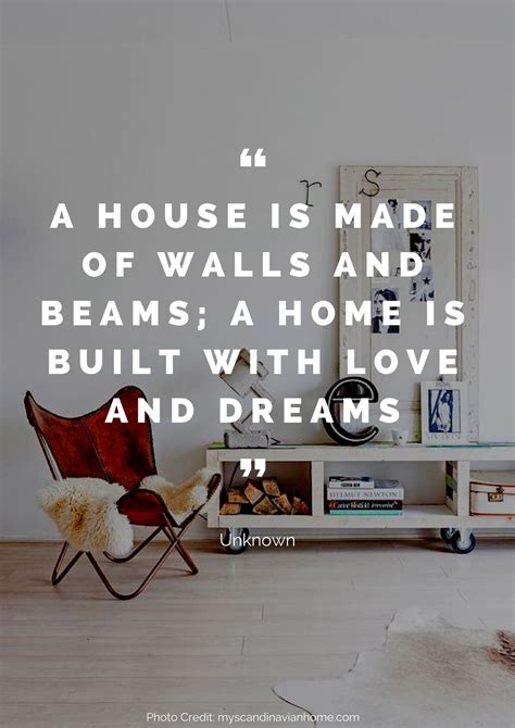 a chair sitting in front of a table with a quote on it that reads, a house is made of walls and ...