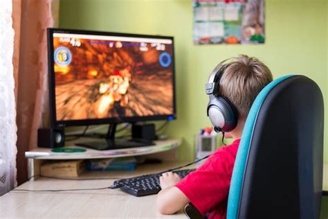 Premium Photo | Child playing computer games