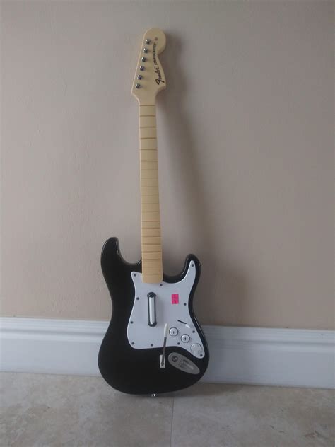 I got this rock band fender stratocaster guitar from a friend for free ...