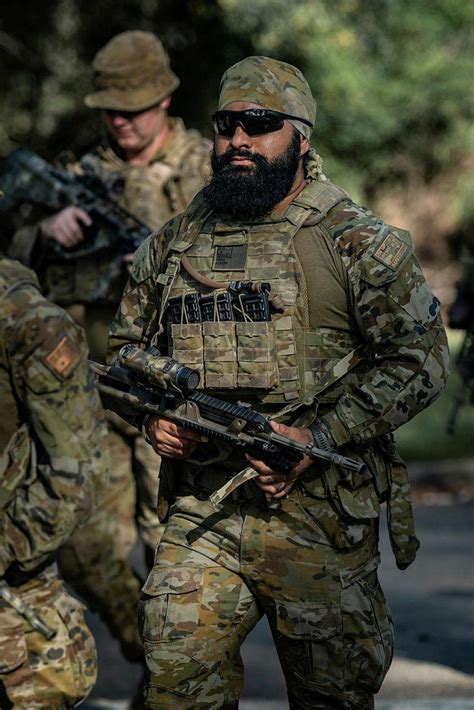 Australian Army Private Dilbag Singh, from the 6th Battalion, Royal Australian Regiment, pack ...