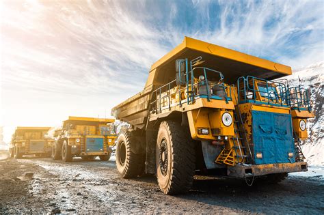 Large quarry dump truck. Loading the rock in dumper. Loading coal into ...