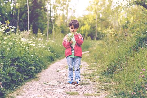 child with flowers in spring 6157576 Stock Photo at Vecteezy