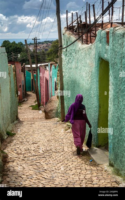 Ethiopia, East Hararghe, Harar, Harar Jugol, Old Walled City, woman amongst colourfully painted ...