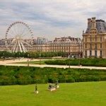 Marble statue and ferris wheel at Garden of Tuileries (Jardin des Tuileries) outside the Louvre ...