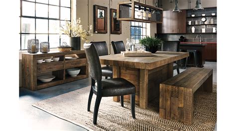 a dining room table surrounded by black leather chairs and wooden cabinets with open shelves on ...