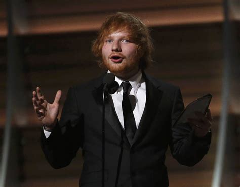 Ed Sheeran accepts the award for Song of the Year for Thinking Out Loud at the 58th Grammy ...