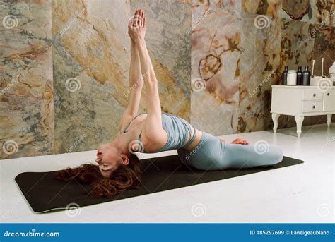 Young Yogini Practicing Matsyasana Pose in Pastel Blue Leggins and Top Stock Image - Image of ...