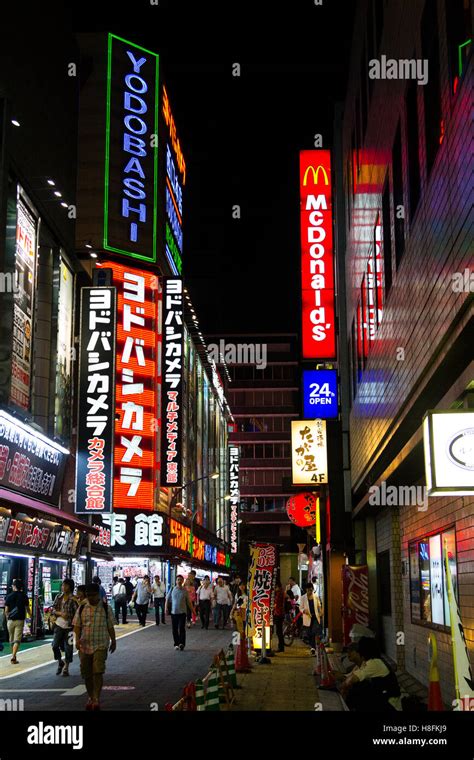 Tokyo, Japan. Neon signs on buildings in the Shinjuku district Stock ...