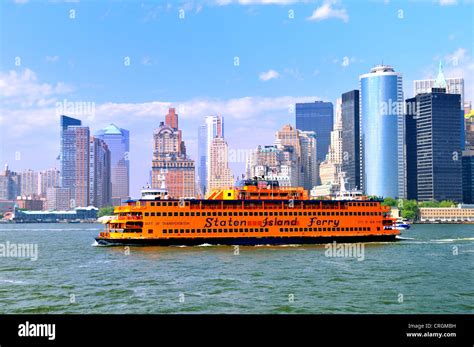 The Staten Island Ferry passes Battery Park as New York skyscrapers ...