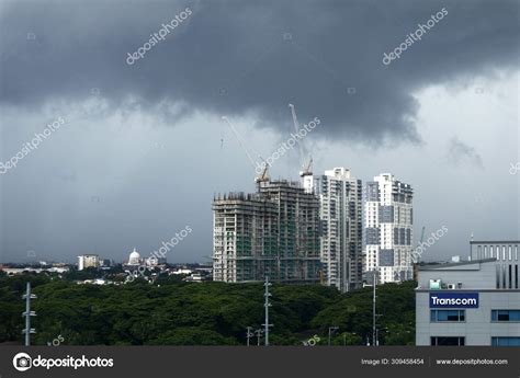 Big and heavy rain clouds over commercial and residential buildings. – Stock Editorial Photo ...