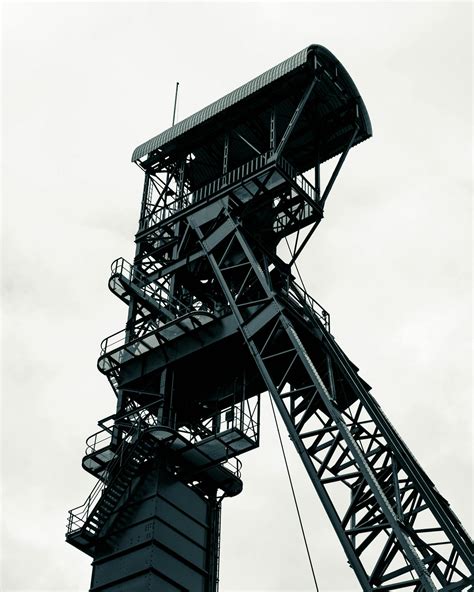Black Metal Tower Under White Clouds · Free Stock Photo
