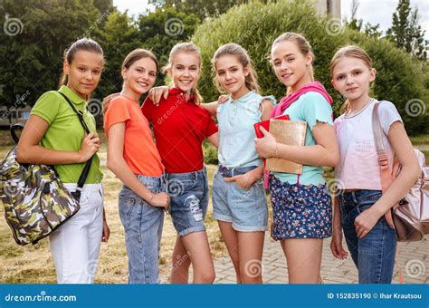 Group of Schoolchildren Laughing and Embracing Stock Photo - Image of girls, teen: 152835190