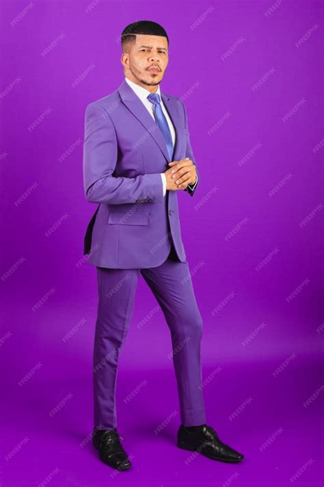 Premium Photo | Brazilian black man dressed in a suit and purple tie ...