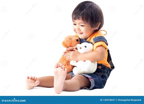 Little Girl is Playing Dolls Stock Image - Image of animal, dolls: 135918647