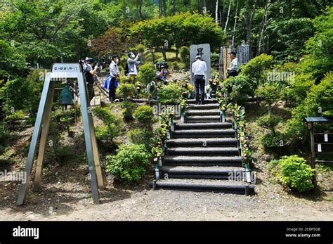 Japan Airlines (JAL) President Yuji Akasaka offers flower at Osutaka ...