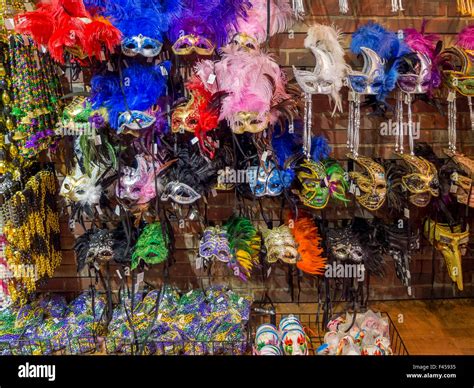 Colorful Mardi Gras masks decorated with feathers are on display in a ...