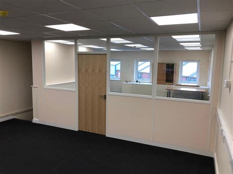 75mm office partitioning with half height double glazing modules and ash office door. | Glass ...