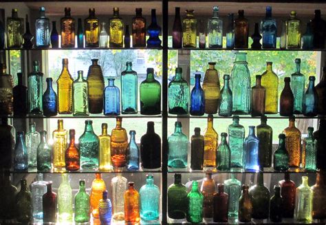 Collection of antique bottles. | Colored glass bottles, Antique bottles ...