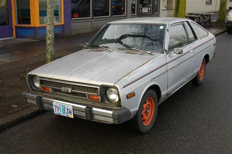 OLD PARKED CARS.: 1979 Datsun 210 Hatchback.