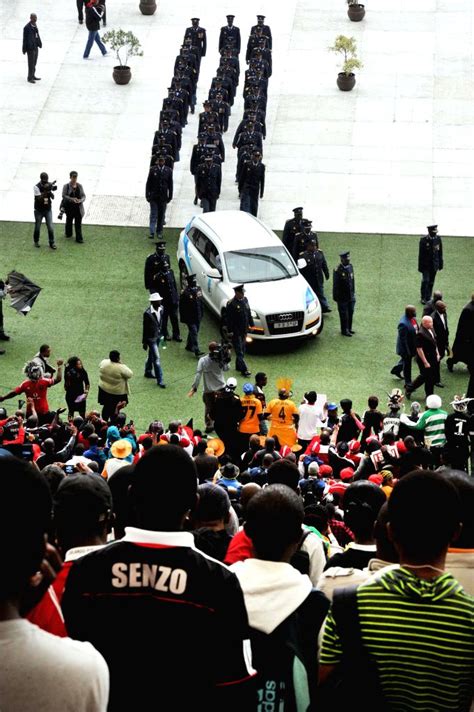 People attend the funeral of Senzo Meyiwa