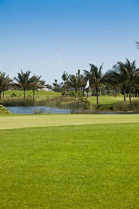 Golf Course and Pin Flag stock photo. Image of landscaped - 14895020