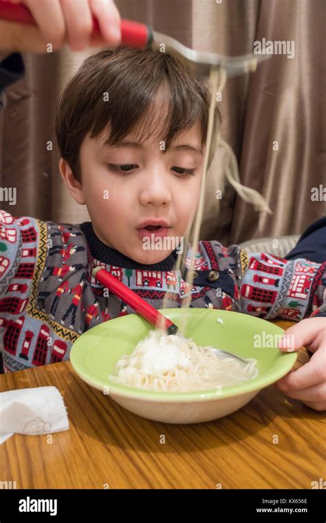 Boy at dining table hi-res stock photography and images - Alamy