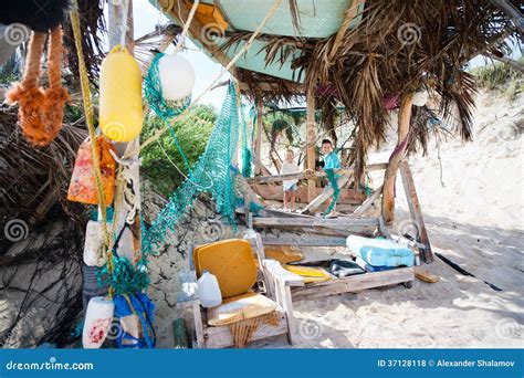 Kids exploring beach hut stock photo. Image of playful - 37128118