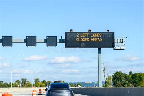 Overhead Electronic Highway Sign, 2 Left Lanes Closed Ahead, on a Sunny ...