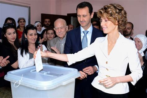 Syrian President Bashar al-Assad accompanied by wife on election day ...