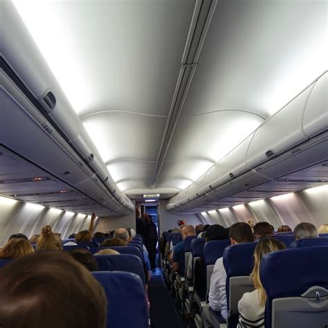 Interior Shot Of An United Airlines Aircraft With Passengers In Their Seats - Travel Off Path