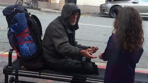 People Giving Food To The Homeless